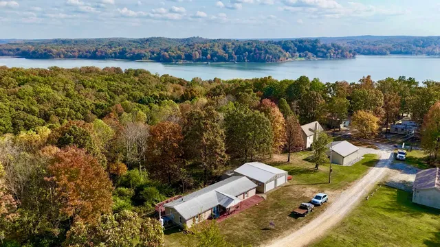 a view of a lake with couches and city view