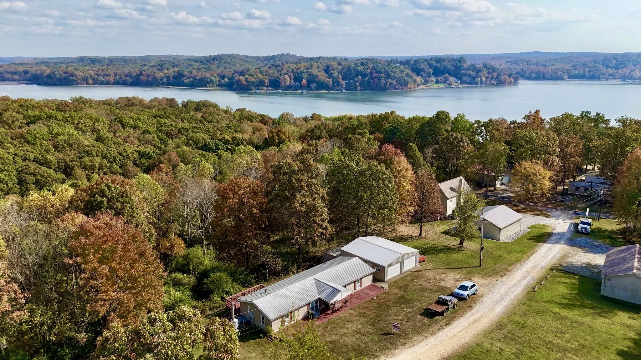 a view of a lake with couches and city view