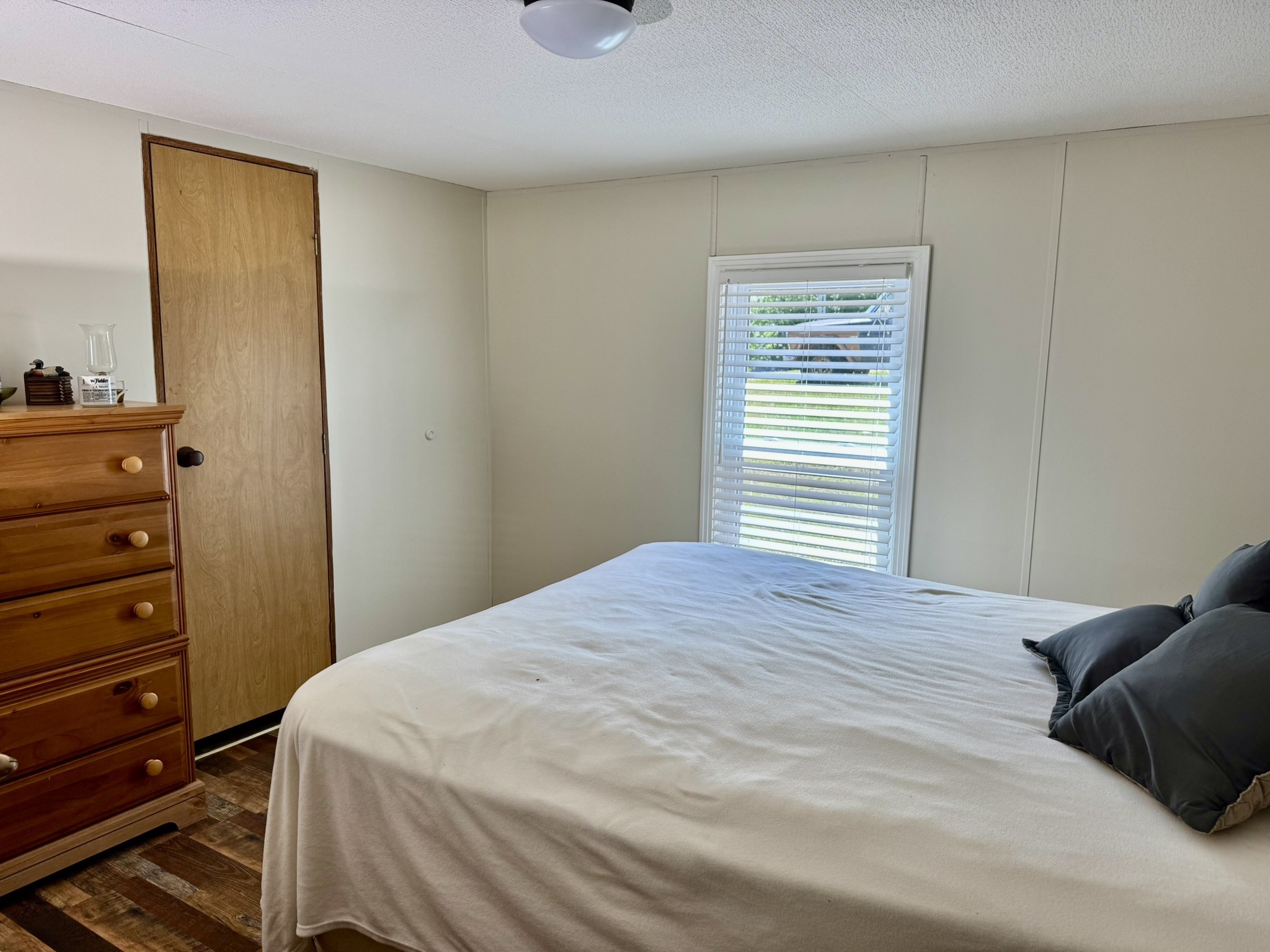 46 Bluff Point Ridge Road Waverly, TN 37185 - Photo 13 of 15 a bedroom with a bed and a dresser
