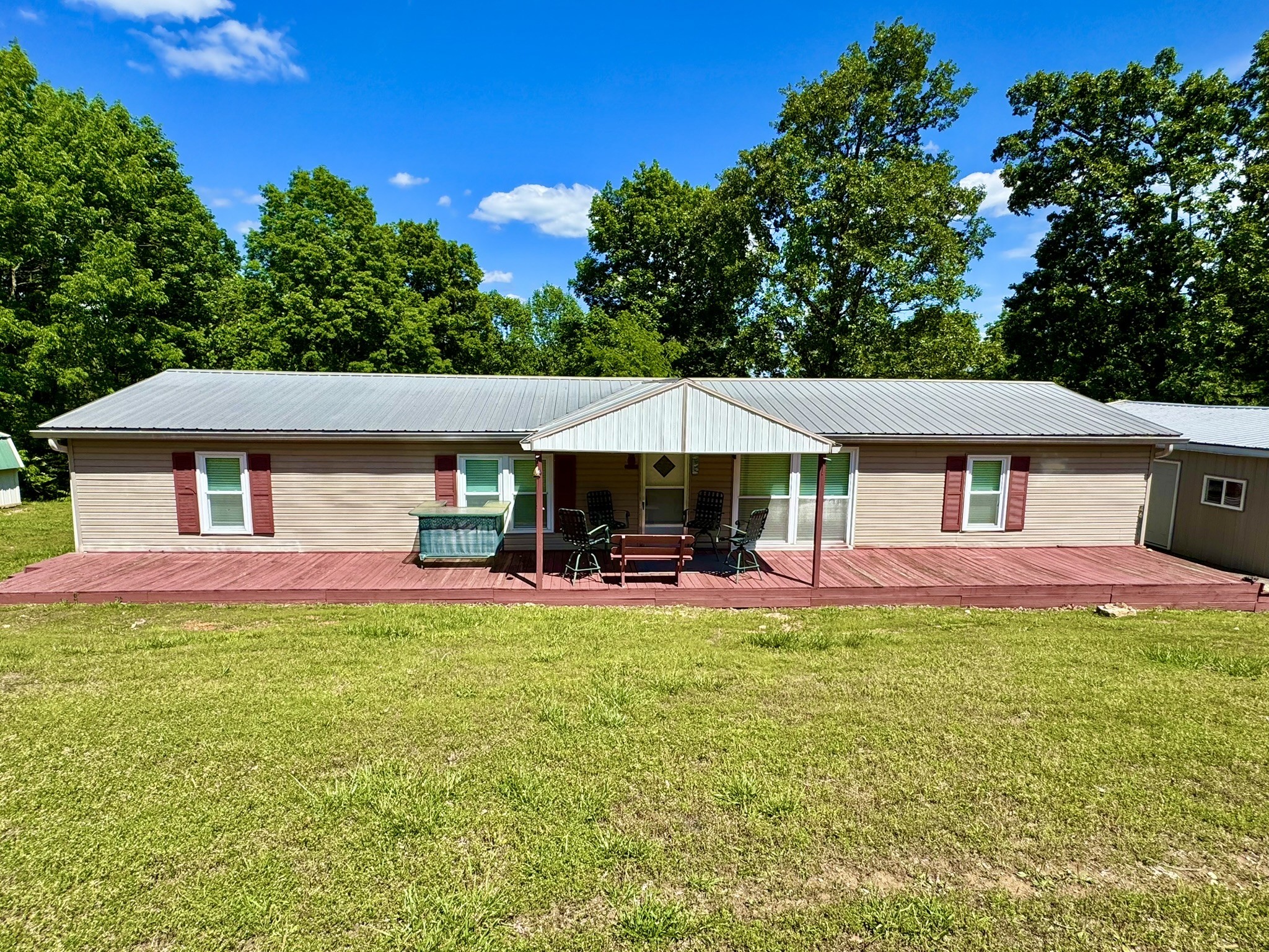 46 Bluff Point Ridge Road Waverly, TN 37185 - Photo 2 of 15 a view of a house with a yard porch and sitting area