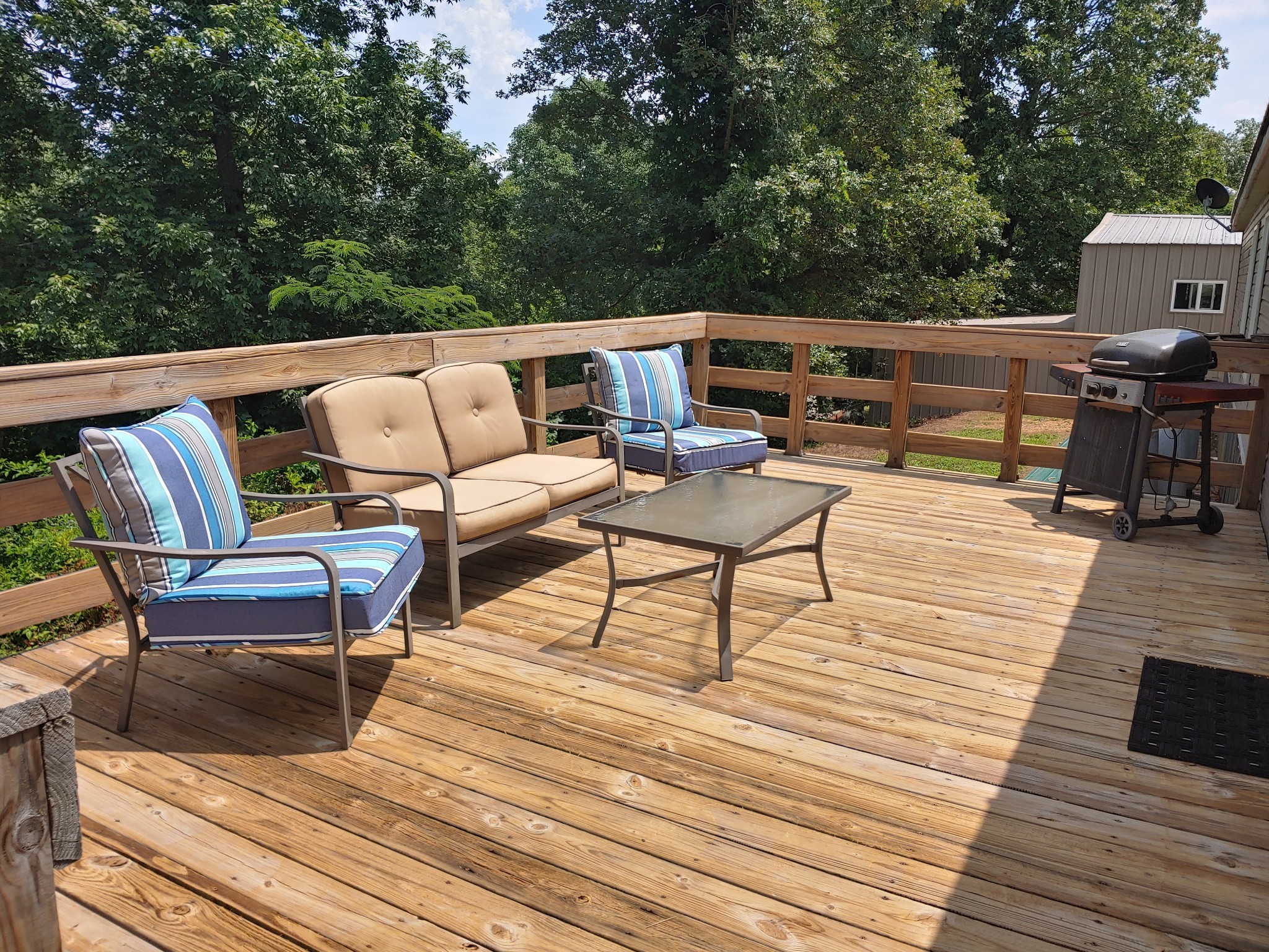 46 Bluff Point Ridge Road Waverly, TN 37185 - Photo 5 of 15 a roof deck view with table and chairs and wooden floor