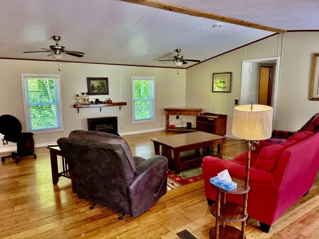 a living room with furniture and a window
