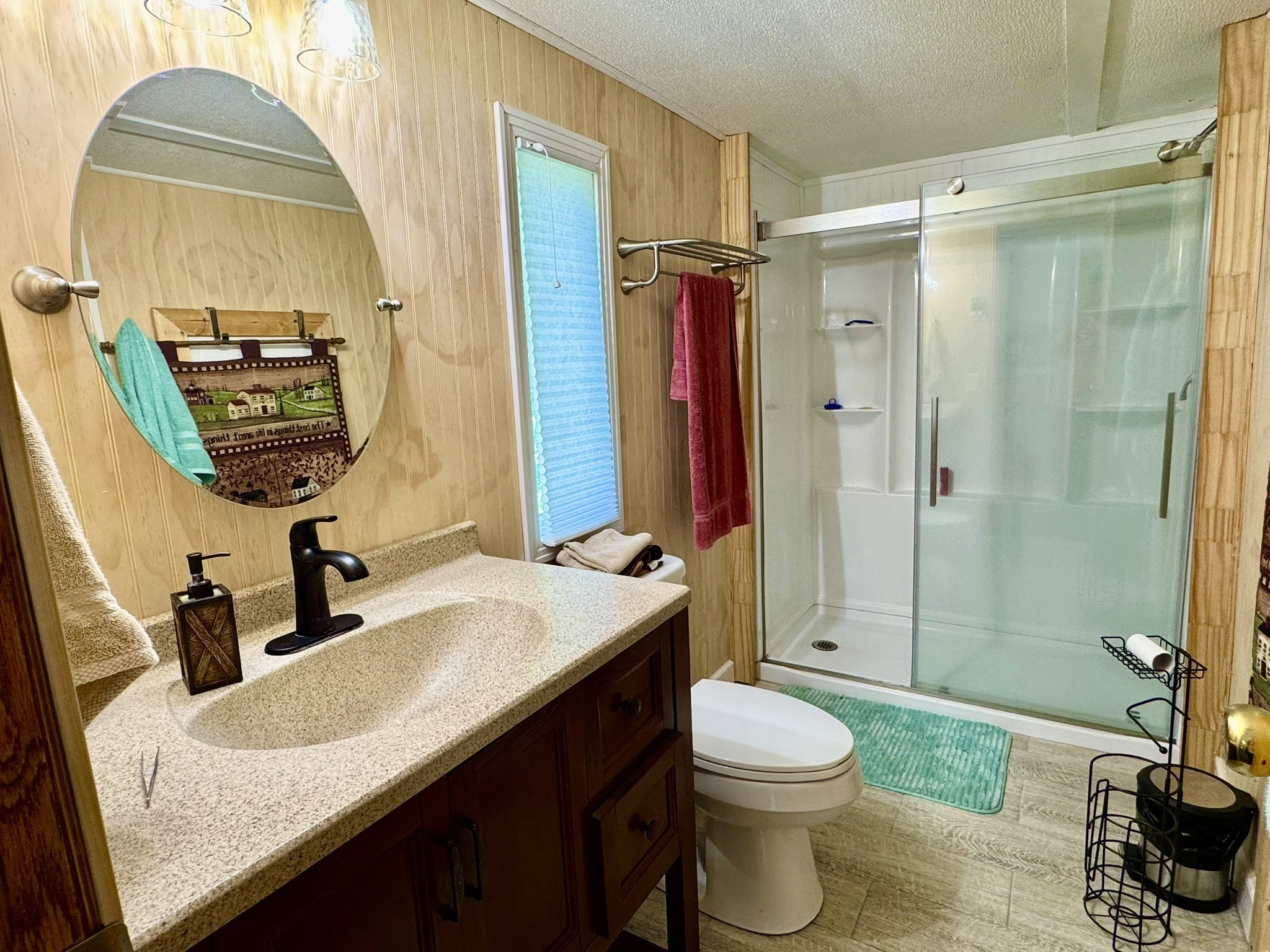 46 Bluff Point Ridge Road Waverly, TN 37185 - Photo 8 of 15 a bathroom with a granite countertop sink toilet and shower
