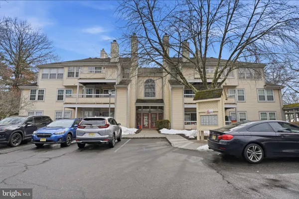 a view of a cars parked in front of a building