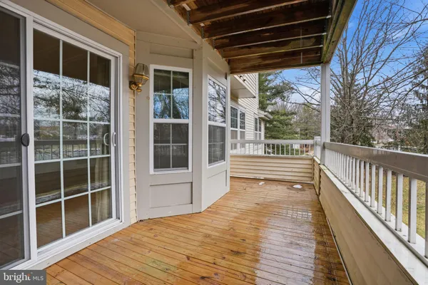 a view of a balcony with wooden floor