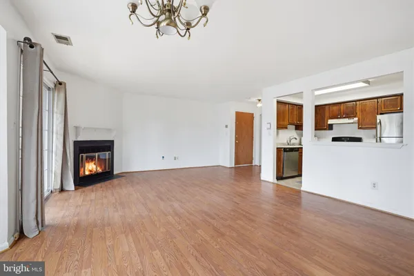 a view of a kitchen with a sink a kitchen a refrigerator and a stove top oven