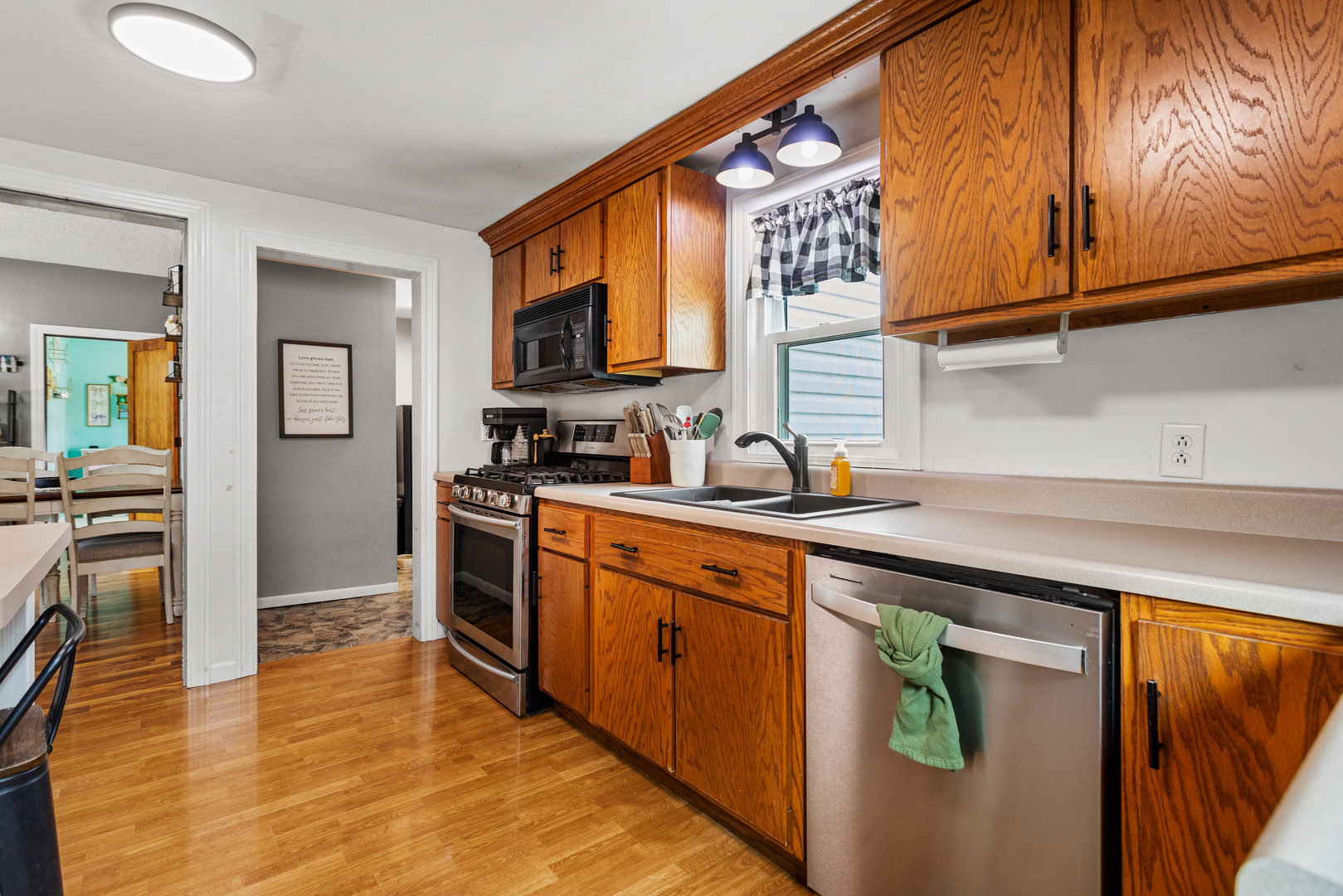 306 Shimp Road Milmine, IL 61855 - Photo 13 of 31 a kitchen with stainless steel appliances granite countertop a sink and cabinets