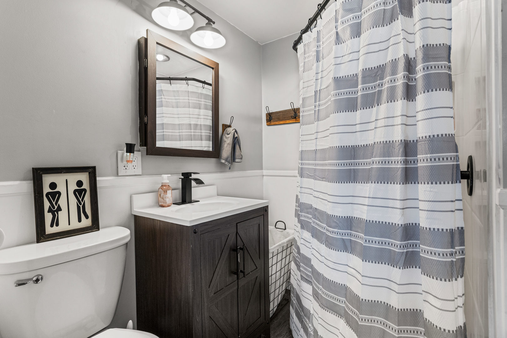 306 Shimp Road Milmine, IL 61855 - Photo 16 of 31 a bathroom with a sink toilet and a mirror
