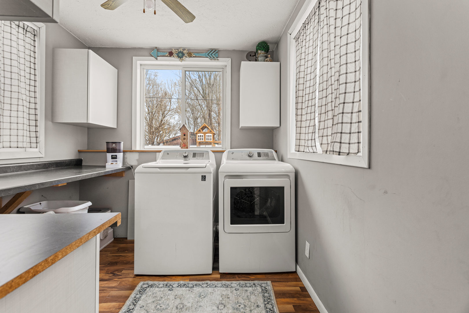 306 Shimp Road Milmine, IL 61855 - Photo 20 of 31 a kitchen with a stove a sink and a microwave
