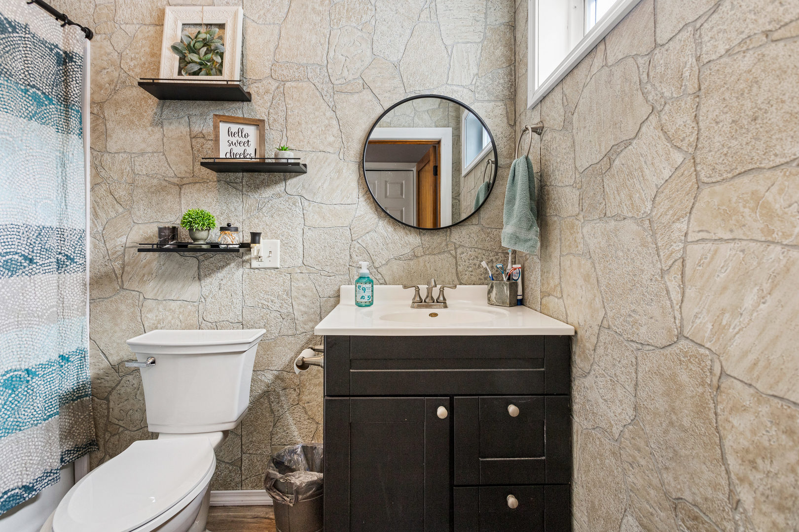 306 Shimp Road Milmine, IL 61855 - Photo 21 of 31 a bathroom with a toilet sink and mirror