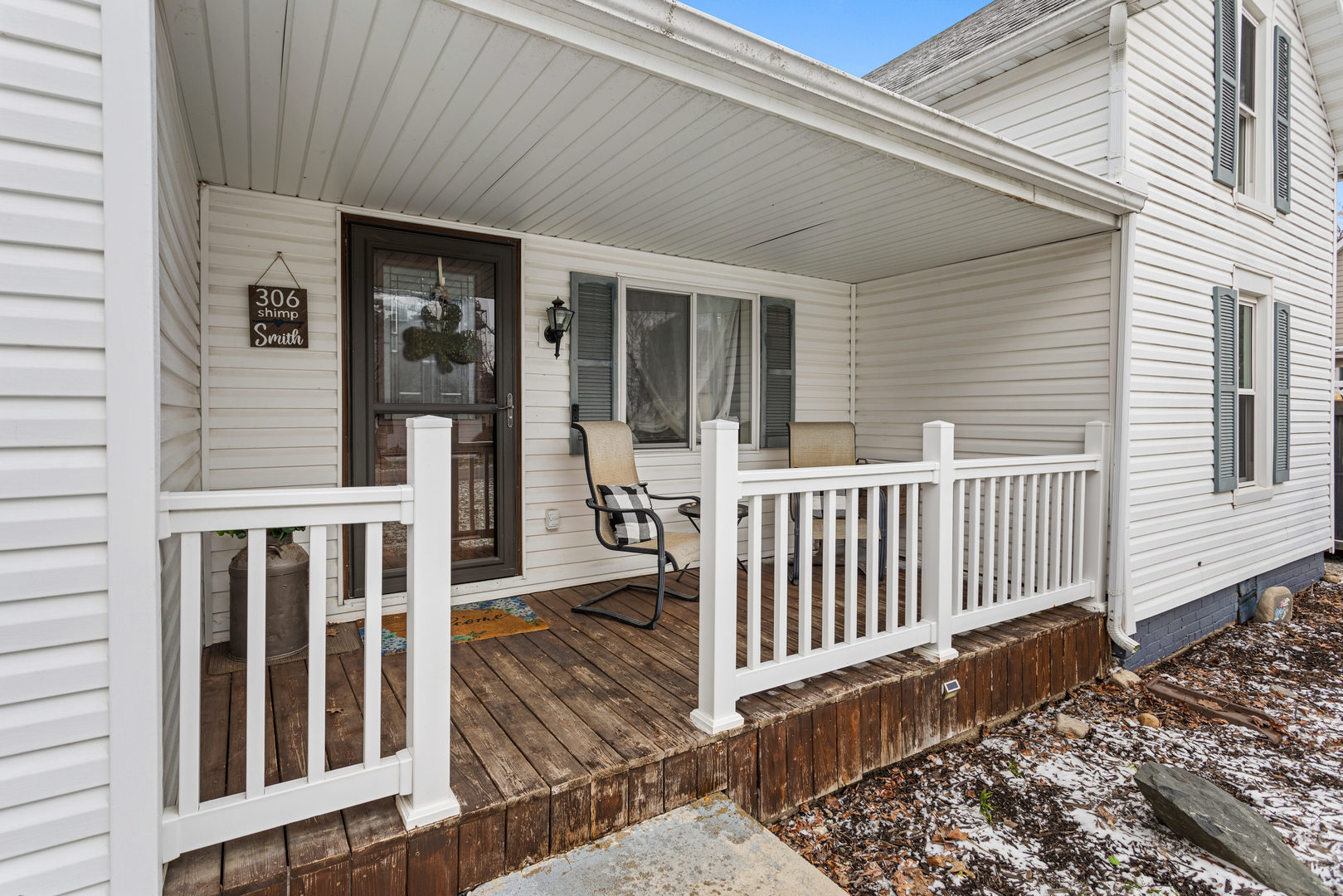 306 Shimp Road Milmine, IL 61855 - Photo 5 of 31 a porch with wooden floor