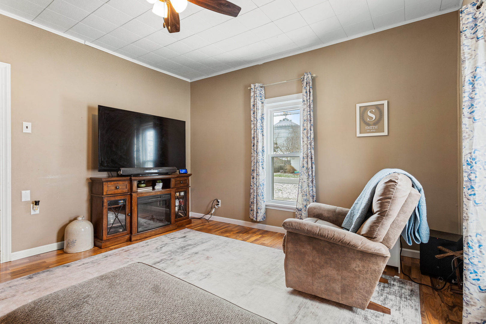 306 Shimp Road Milmine, IL 61855 - Photo 8 of 31 a living room with furniture and a flat screen tv