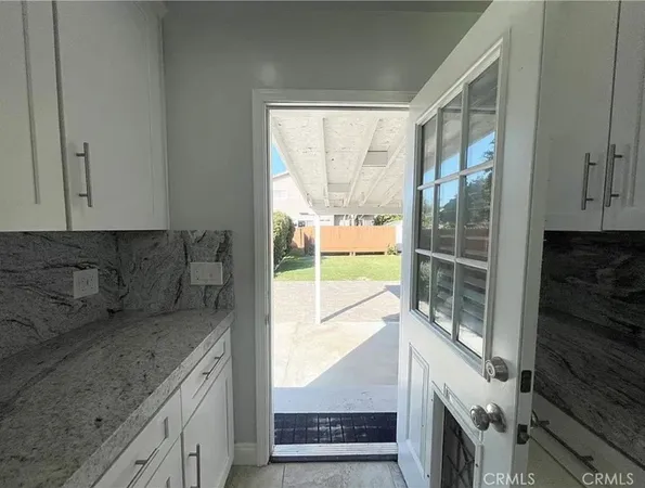 a kitchen with a window a sink and a counter top space