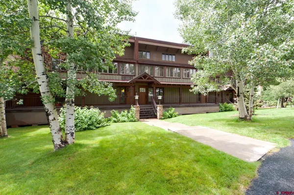 a view of a swimming pool with chairs