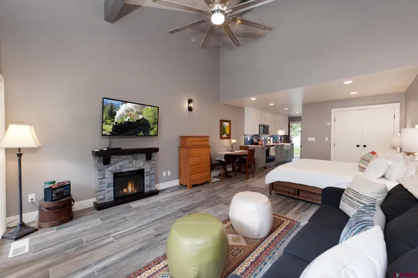 a living room with furniture and a fireplace