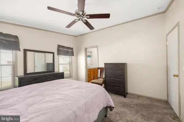 a bedroom with a bed and a dresser