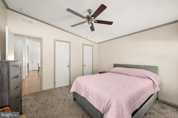 a bedroom with a bed and closet