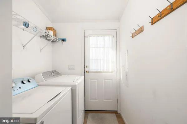 a view of storage and utility room with washer and dryer