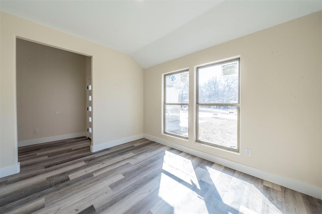 6130 Aztec Drive Mabank, TX 75156 - Photo 14 of 31 an empty room with wooden floor and windows
