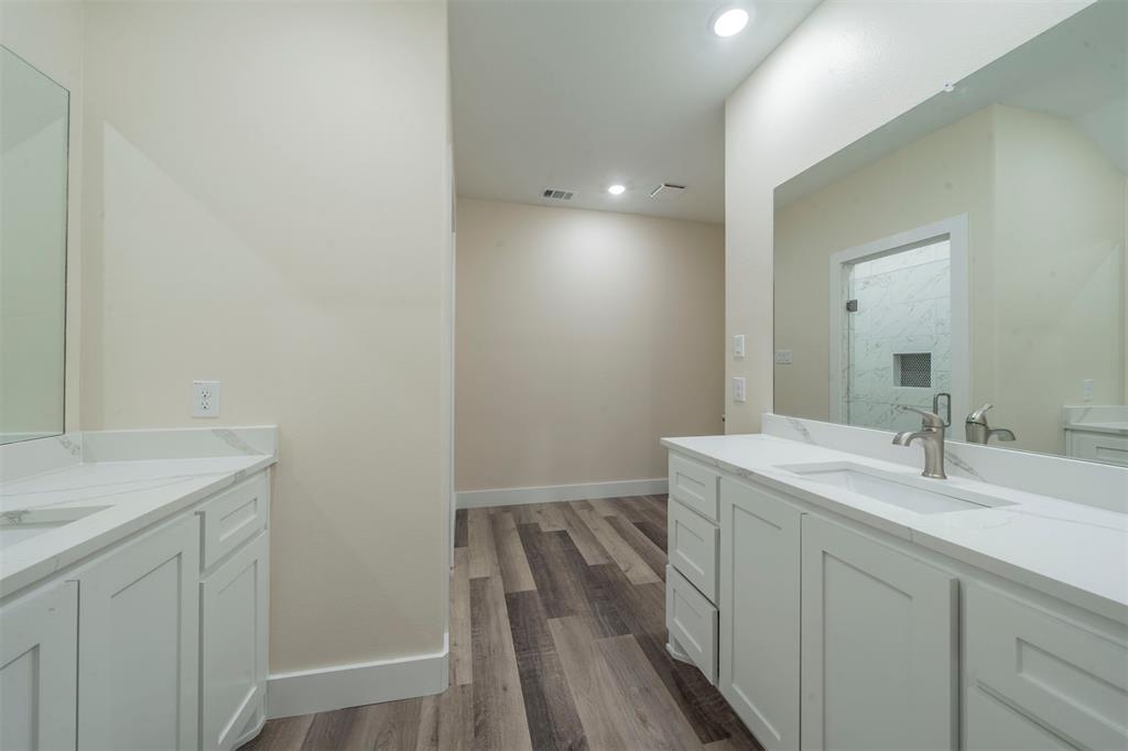 6130 Aztec Drive Mabank, TX 75156 - Photo 20 of 31 a bathroom with a sink and a mirror