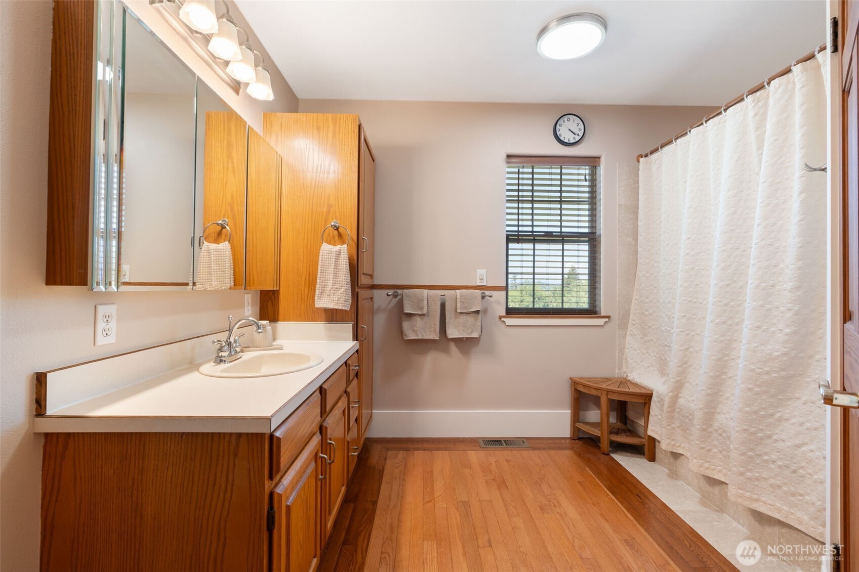 308 Brockway Road Chehalis, WA 98532 - Photo 22 of 40 a bathroom with a sink a mirror and a shower