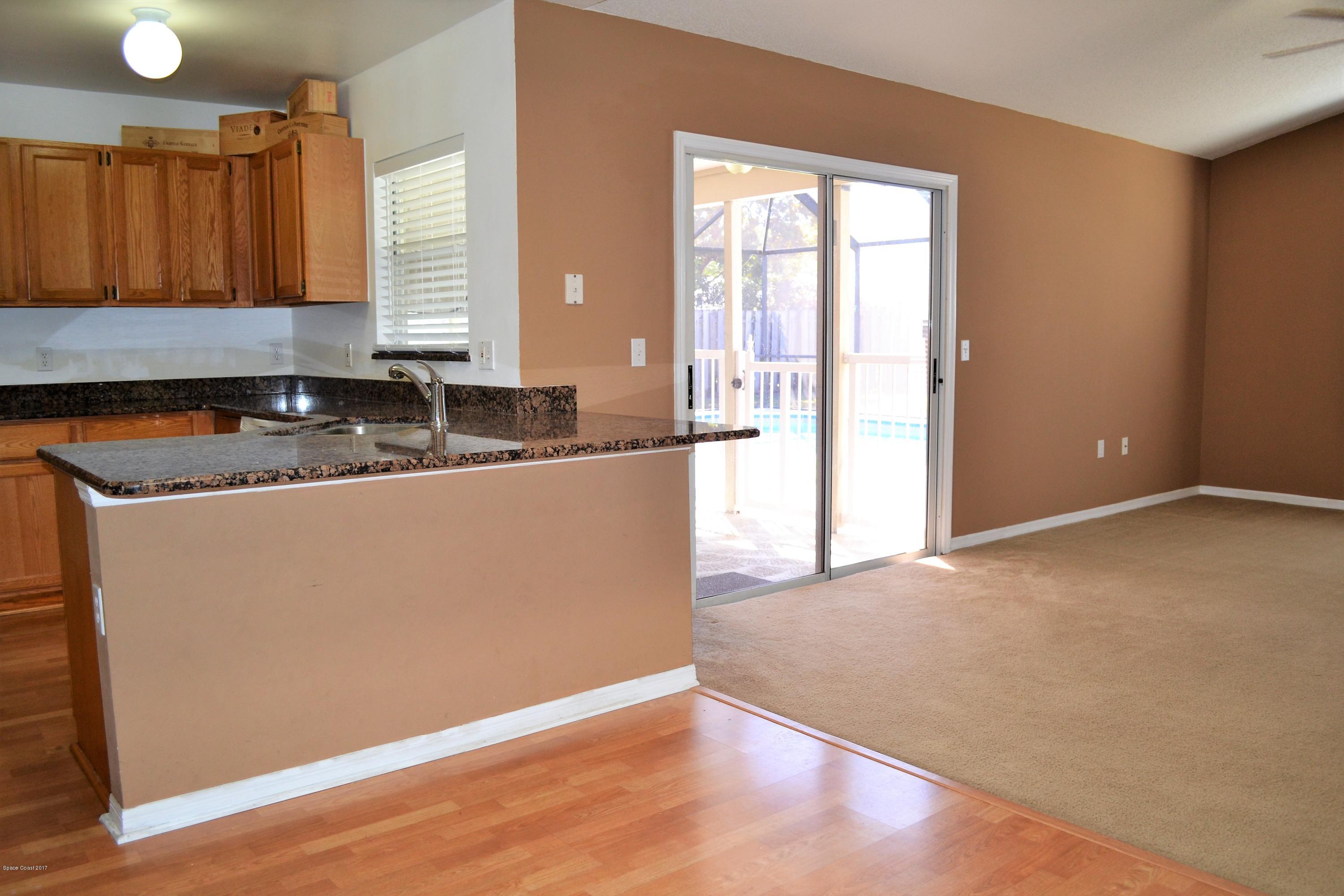235 Twin Lakes Road Melbourne, FL 32901 - Photo 6 of 27 breakfast bar in kitchen
