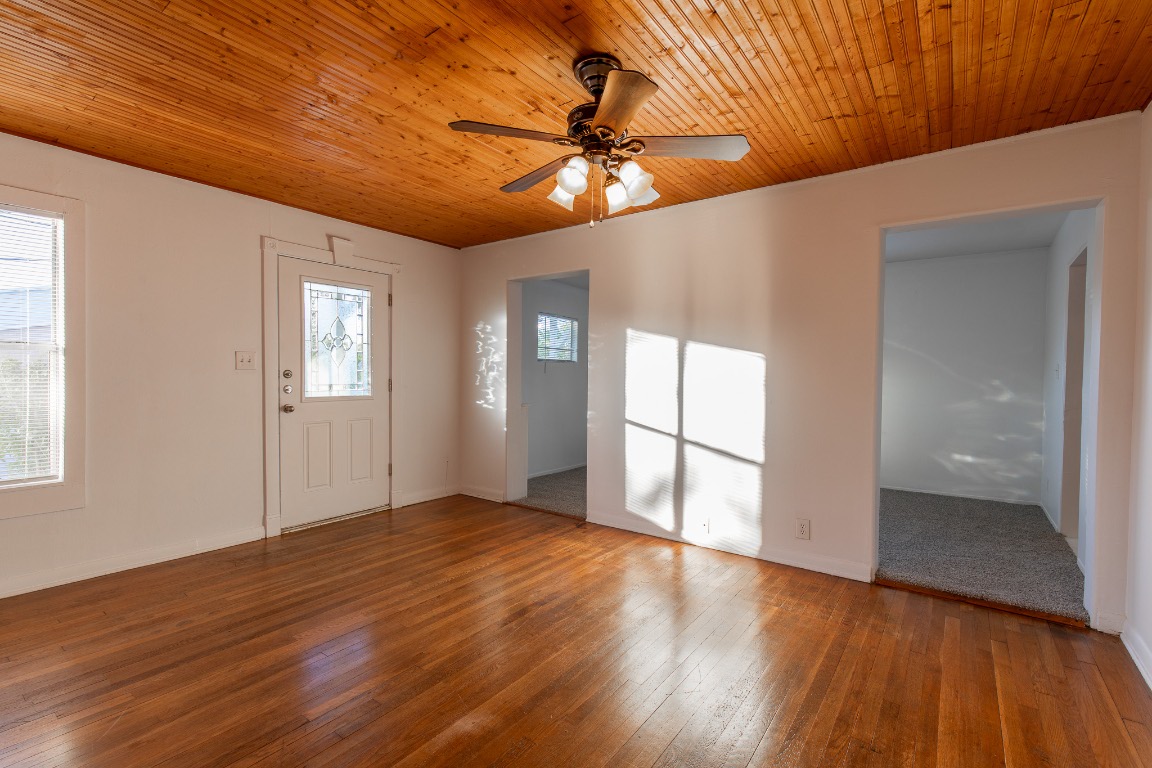 5515 Roosevelt Avenue Austin, TX 78756 - Photo 6 of 17 a view of an empty room with window and wooden floor