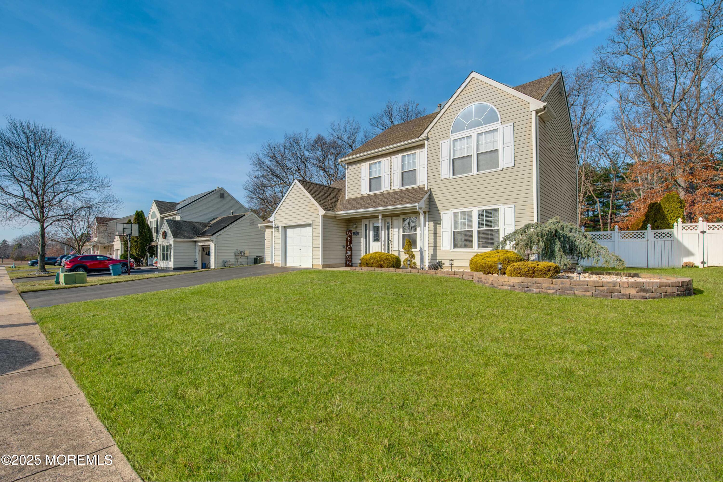 20 Capitol Reef Road Howell, NJ 07731 - Photo 1 of 38 a front view of a house with a garden and yard