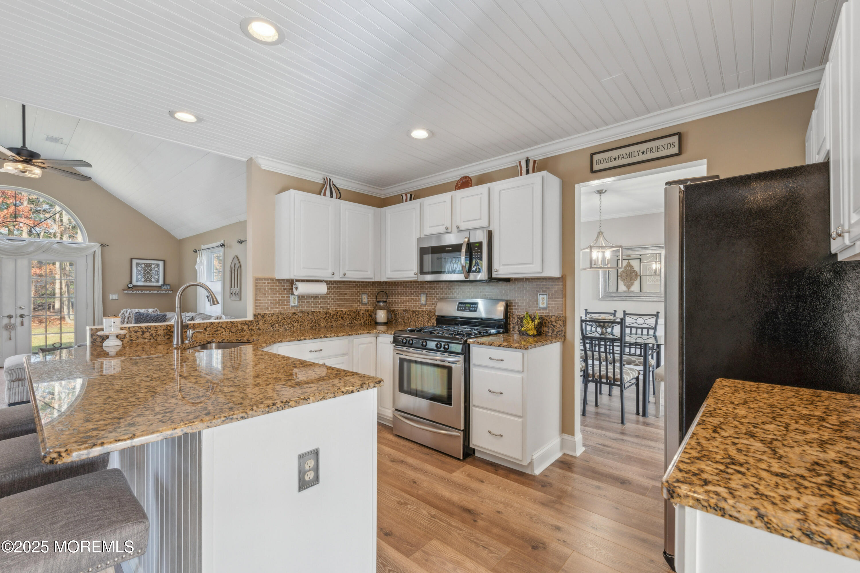 20 Capitol Reef Road Howell, NJ 07731 - Photo 13 of 38 a kitchen with stainless steel appliances granite countertop a refrigerator stove microwave and sink