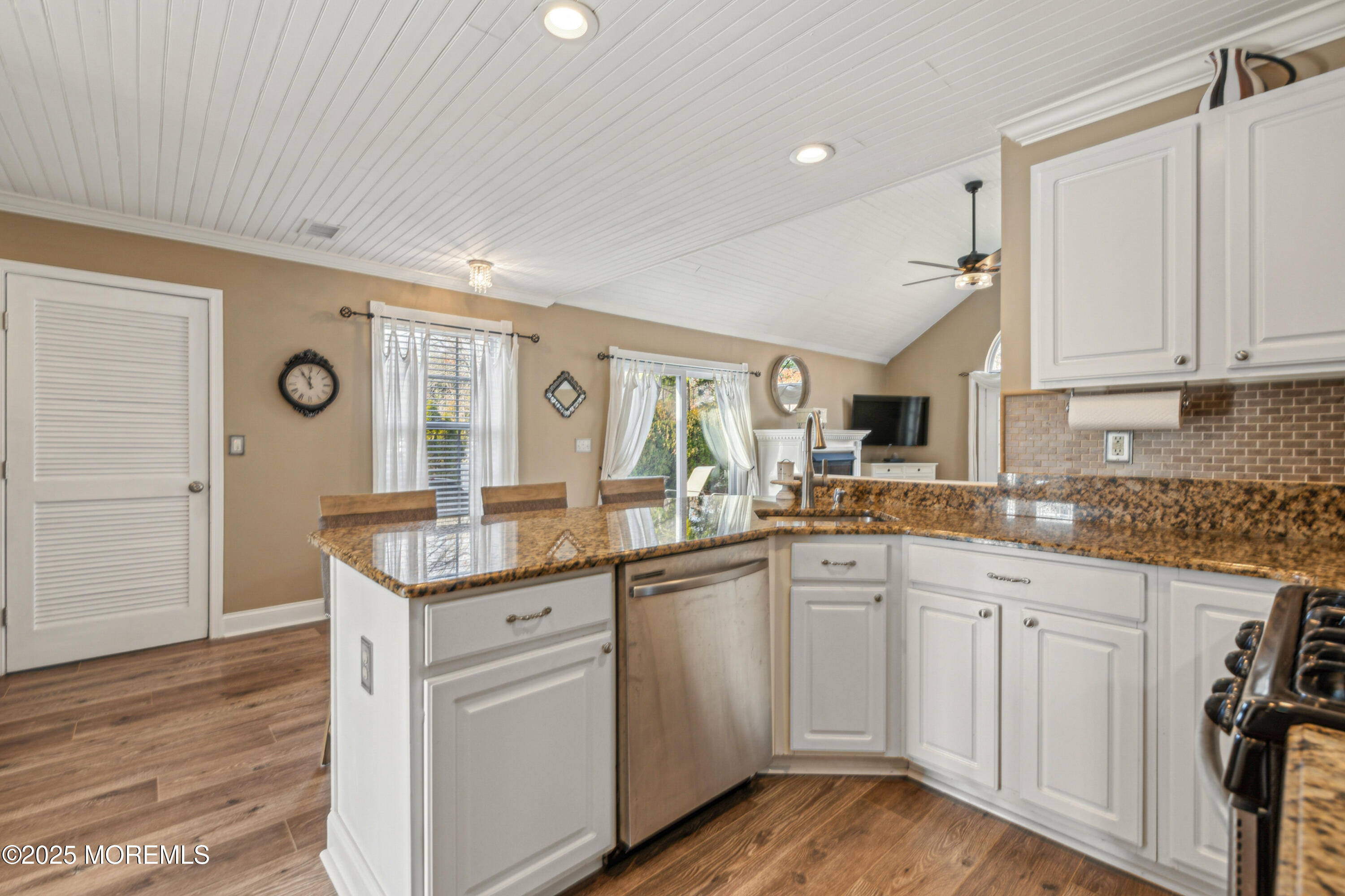 20 Capitol Reef Road Howell, NJ 07731 - Photo 16 of 38 a kitchen with white cabinets and sink