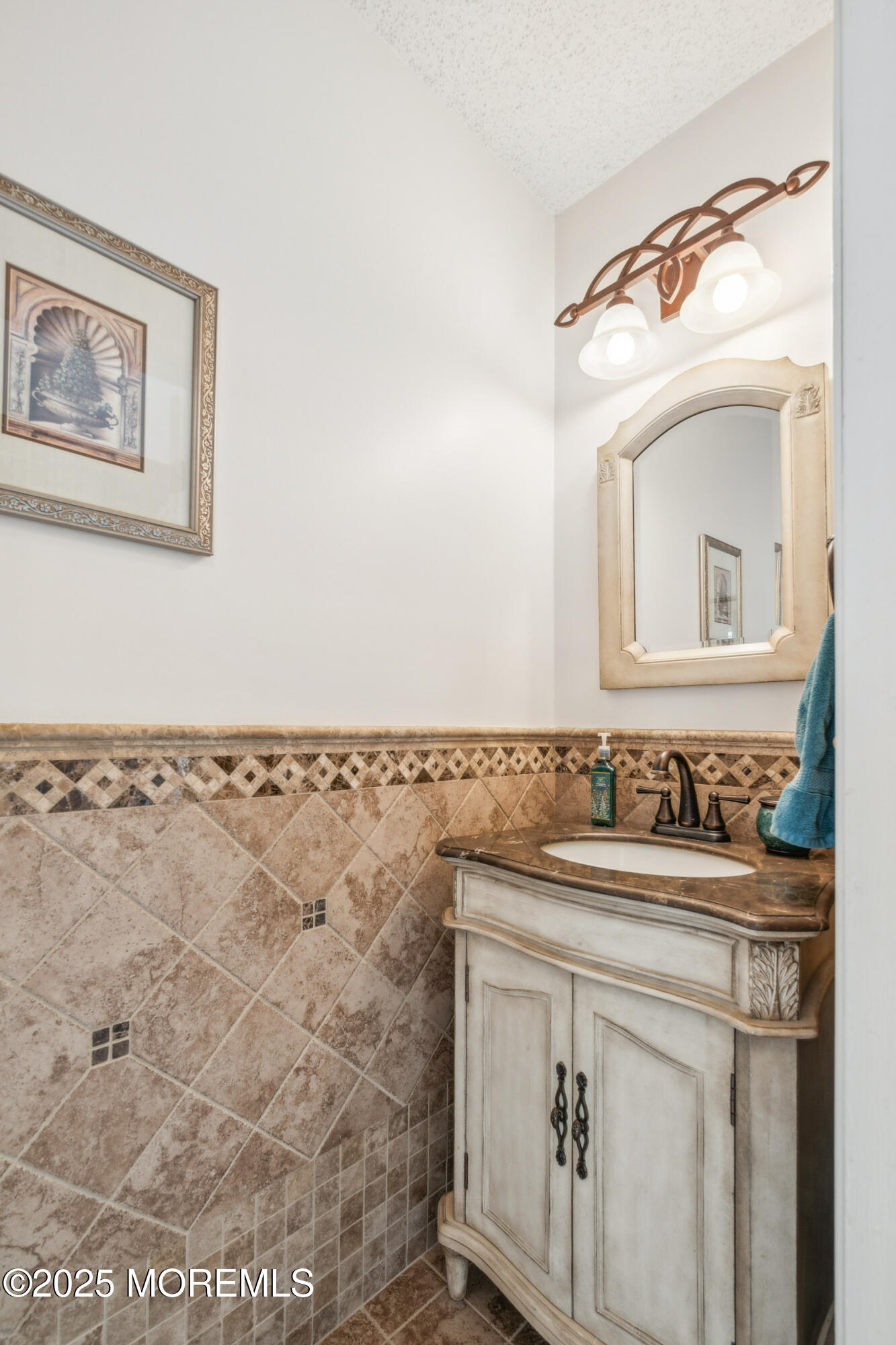 20 Capitol Reef Road Howell, NJ 07731 - Photo 22 of 38 a bathroom with a sink and a mirror