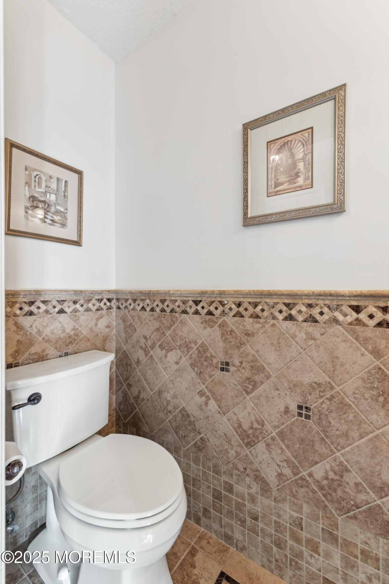 20 Capitol Reef Road Howell, NJ 07731 - Photo 23 of 38 a white toilet sitting next to a bathroom and a sink