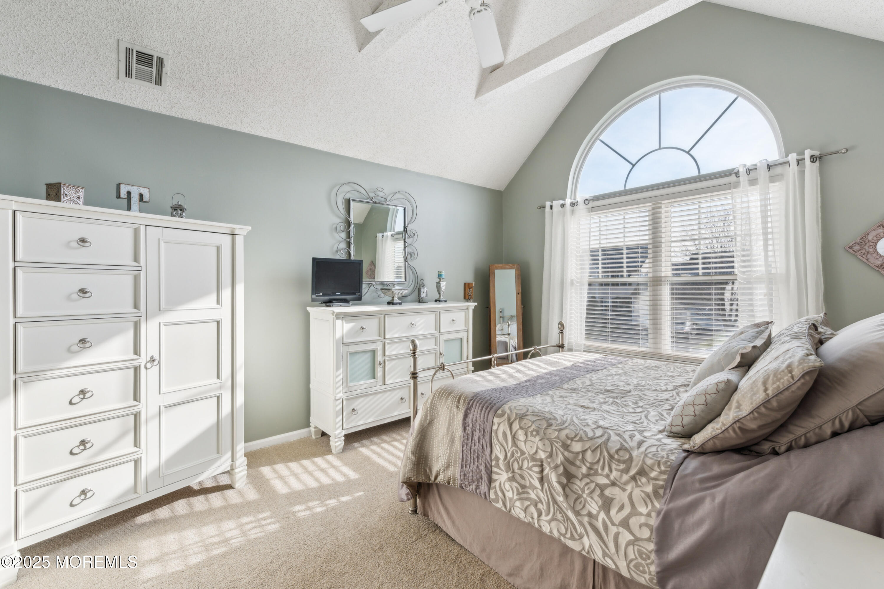 20 Capitol Reef Road Howell, NJ 07731 - Photo 24 of 38 a spacious bedroom with a bed a dresser and large windows