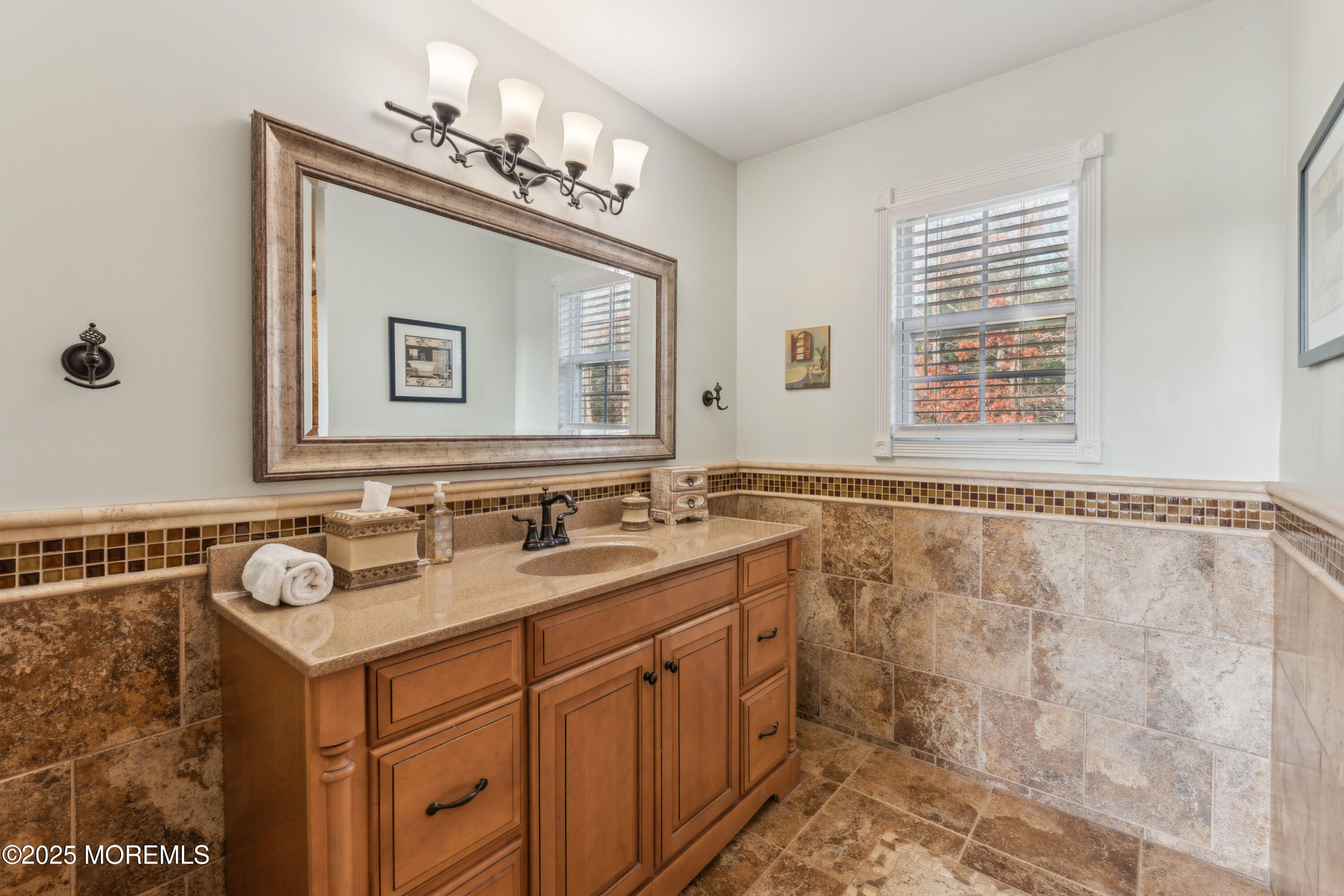 20 Capitol Reef Road Howell, NJ 07731 - Photo 27 of 38 a bathroom with a sink and a mirror