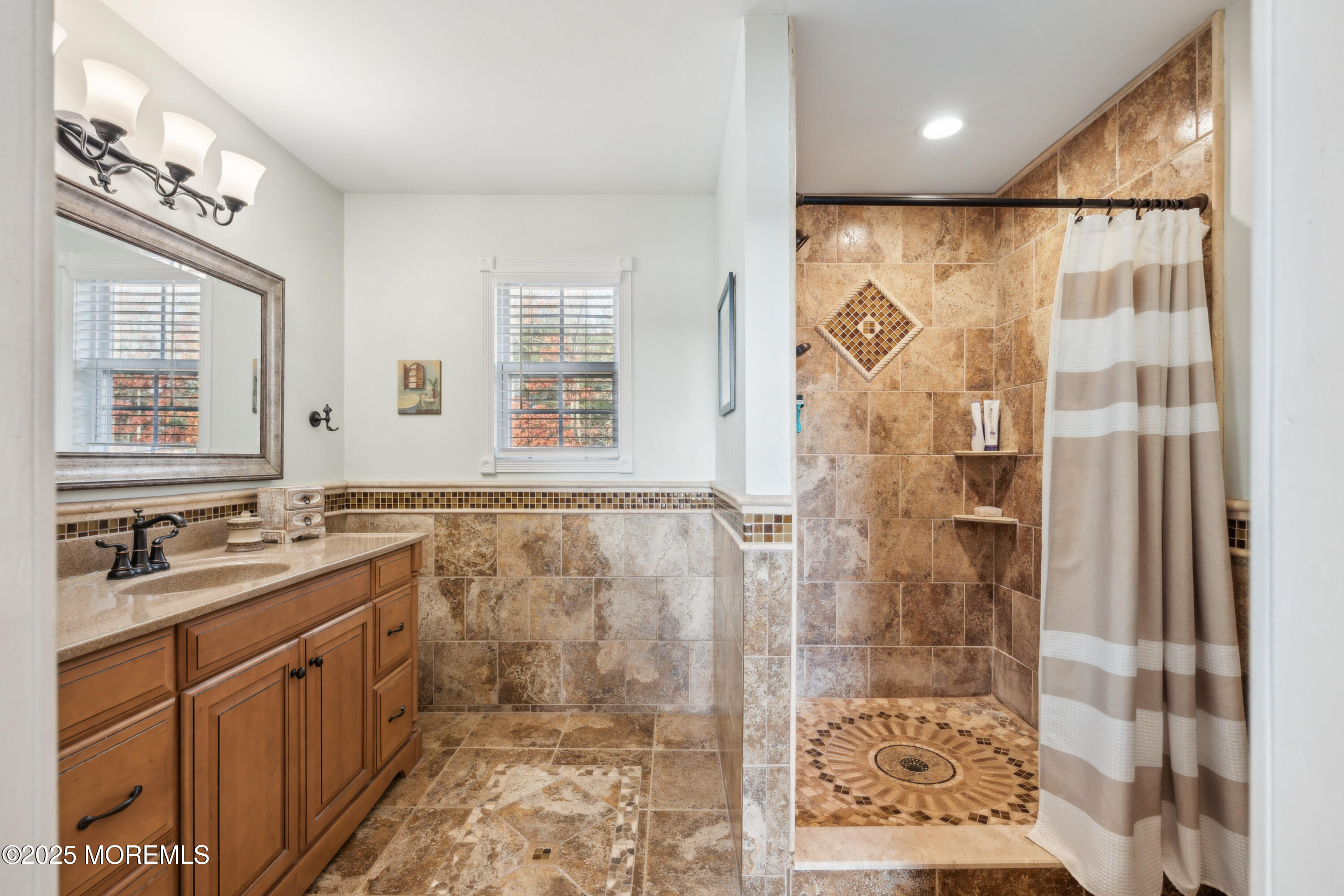 20 Capitol Reef Road Howell, NJ 07731 - Photo 28 of 38 a bathroom with a double vanity sink a mirror and a shower