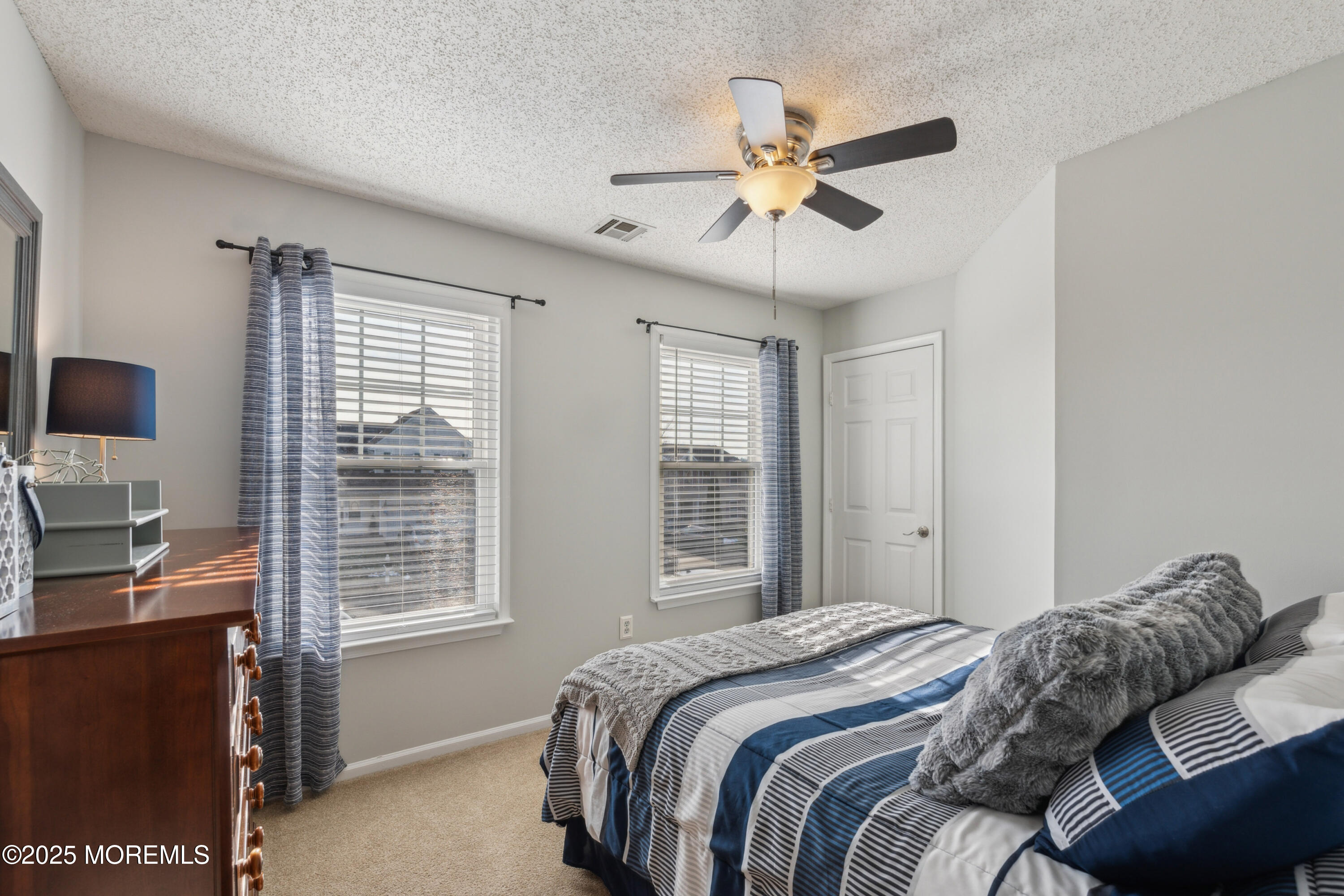 20 Capitol Reef Road Howell, NJ 07731 - Photo 31 of 38 a bedroom with a large bed and a window