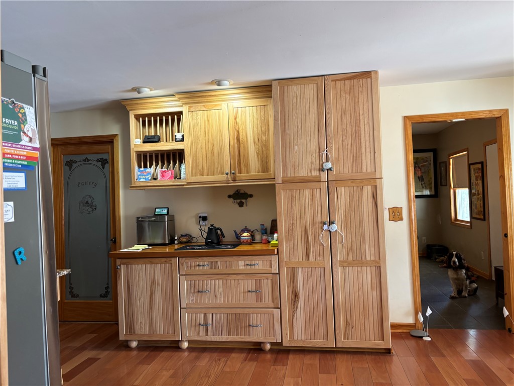 172 Hawks Road Pittsfield, NY 13411 - Photo 10 of 49 Laundry room door to the left of pantry to the rig