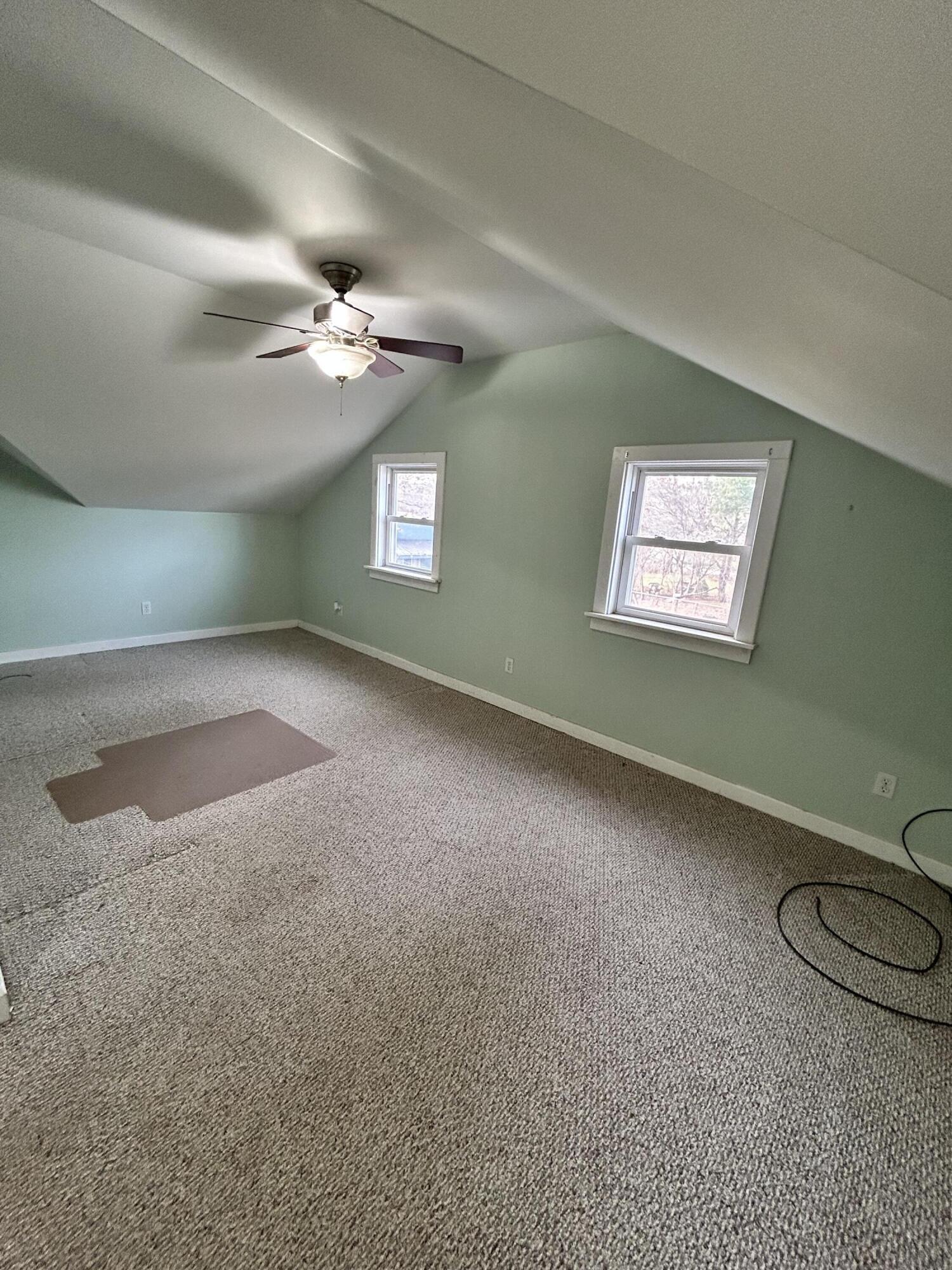 708 South Main Street Kouts, IN 46347 - Photo 11 of 22 an empty room with a empty space and windows