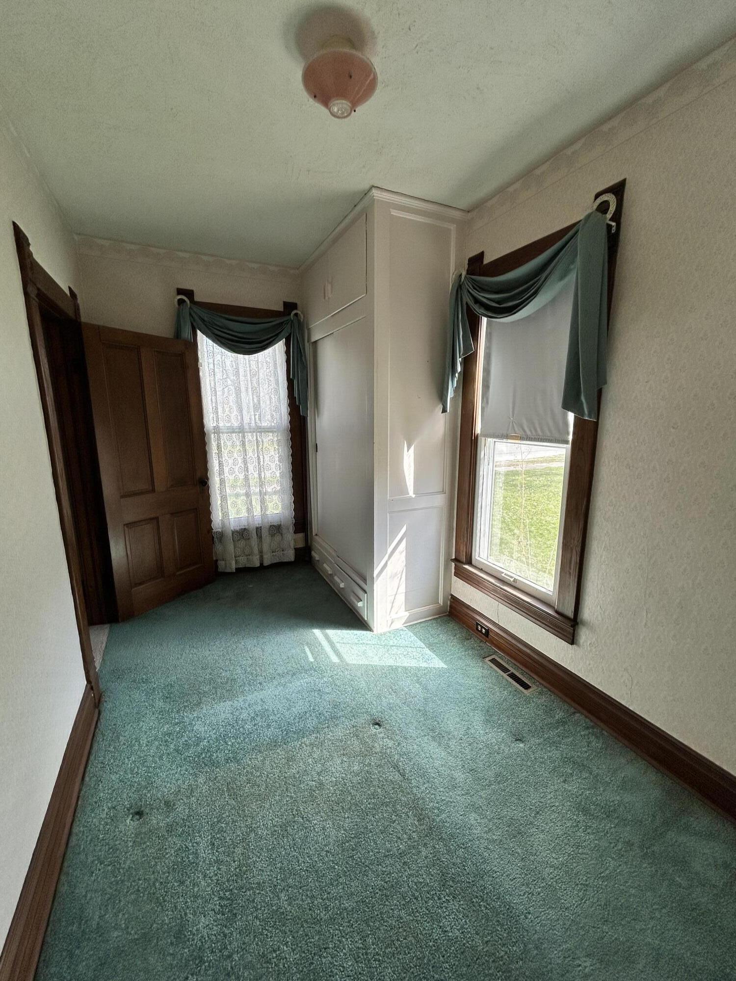 708 South Main Street Kouts, IN 46347 - Photo 14 of 22 an empty room with windows