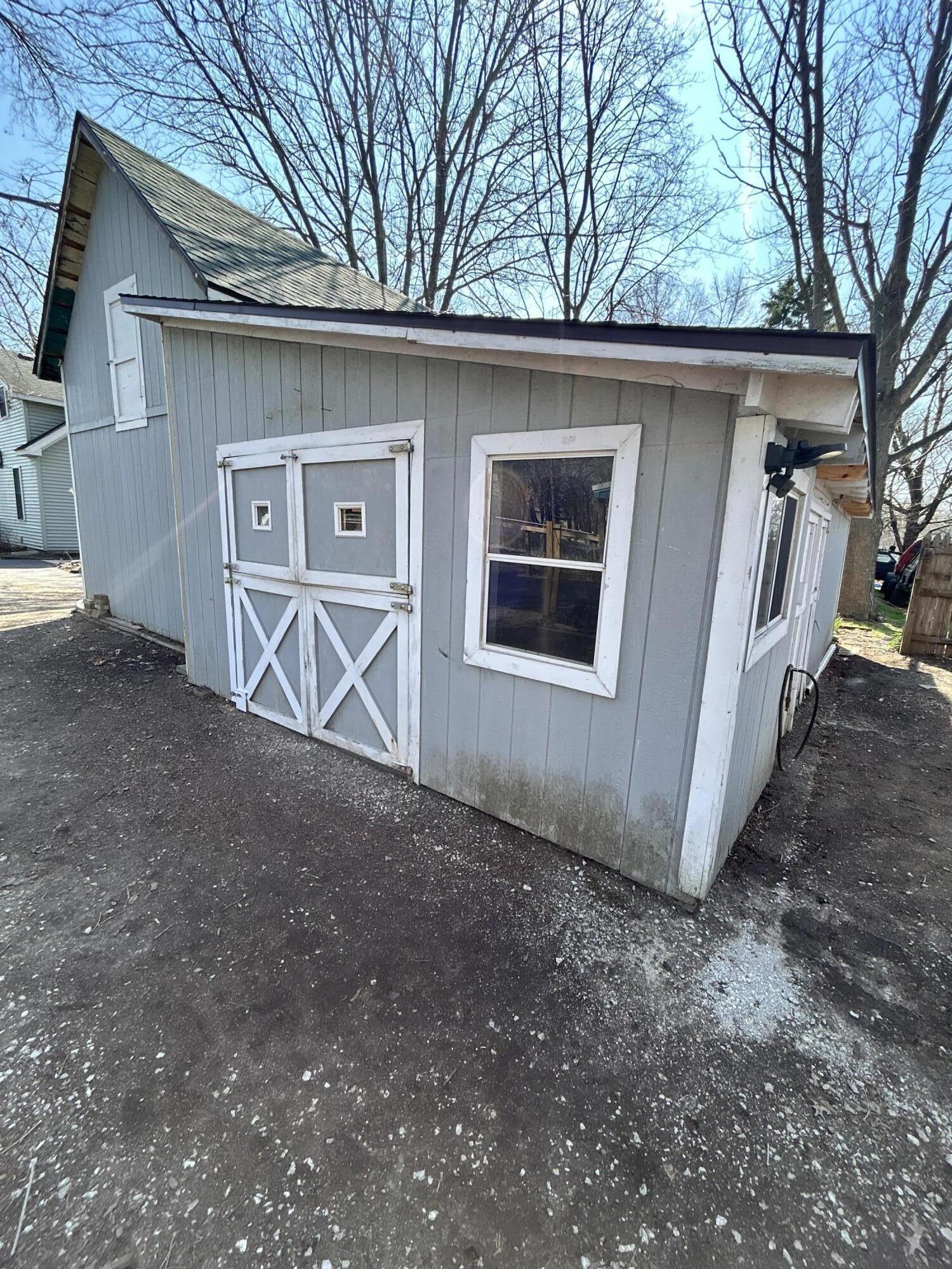 708 South Main Street Kouts, IN 46347 - Photo 20 of 22 a front view of a house with parking space