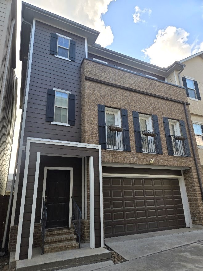 Welcome home to 4109 Allen Street, a beautiful 3-story townhouse in the gated community of Allen Trace. Front exterior of home. Includes attached 2-car garage.