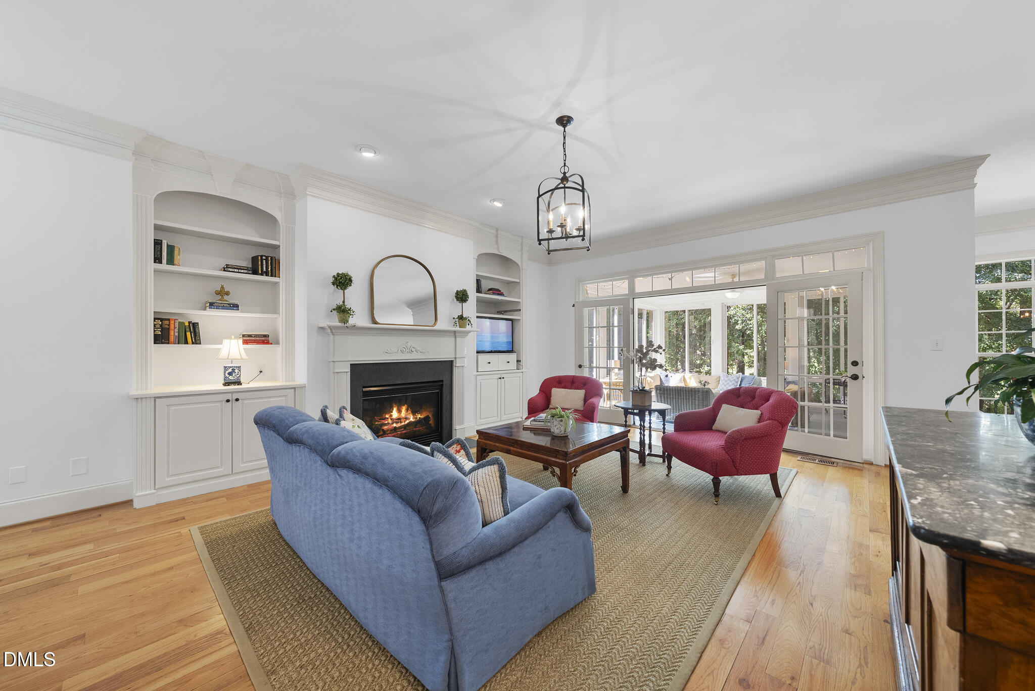 119 Faison Road Chapel Hill, NC 27517 - Photo 17 of 93 a living room with furniture a fireplace and a floor to ceiling window