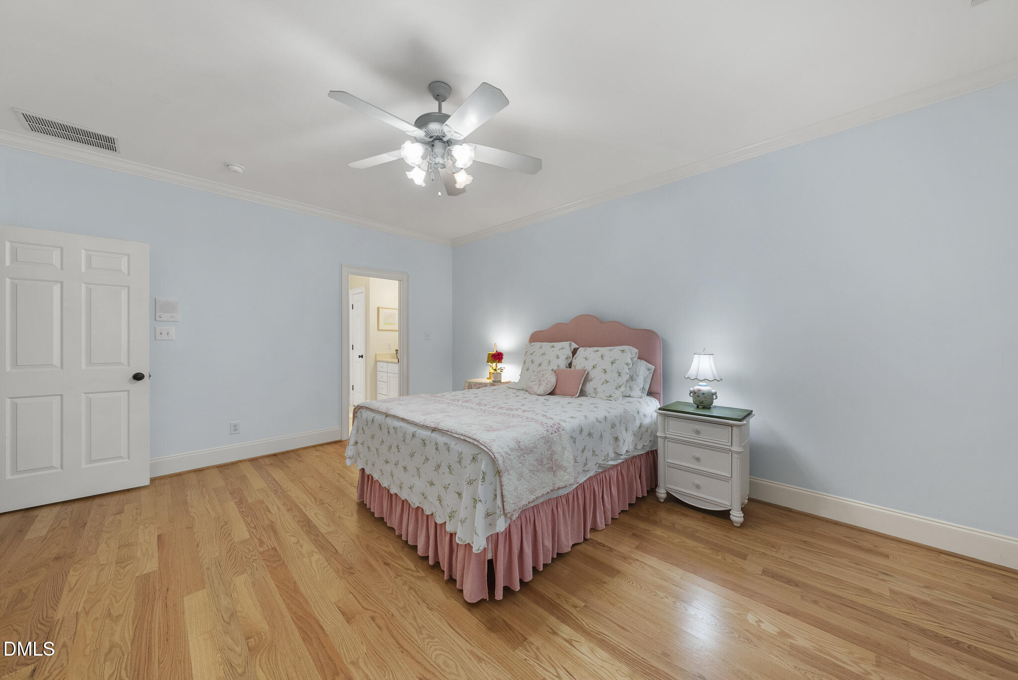 119 Faison Road Chapel Hill, NC 27517 - Photo 48 of 93 a bedroom with a bed and a chandelier