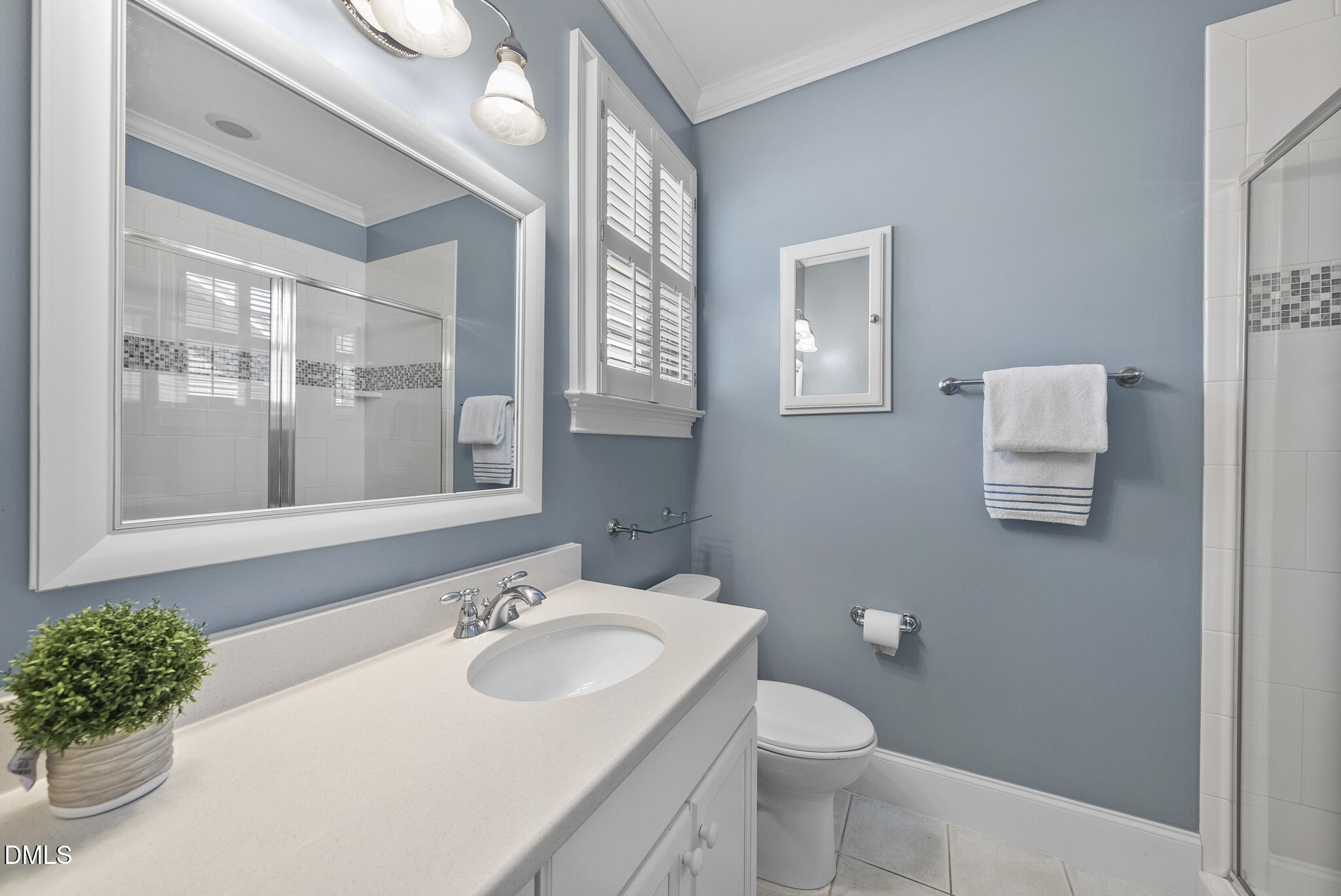 119 Faison Road Chapel Hill, NC 27517 - Photo 53 of 93 a bathroom with a sink and mirror with toilet