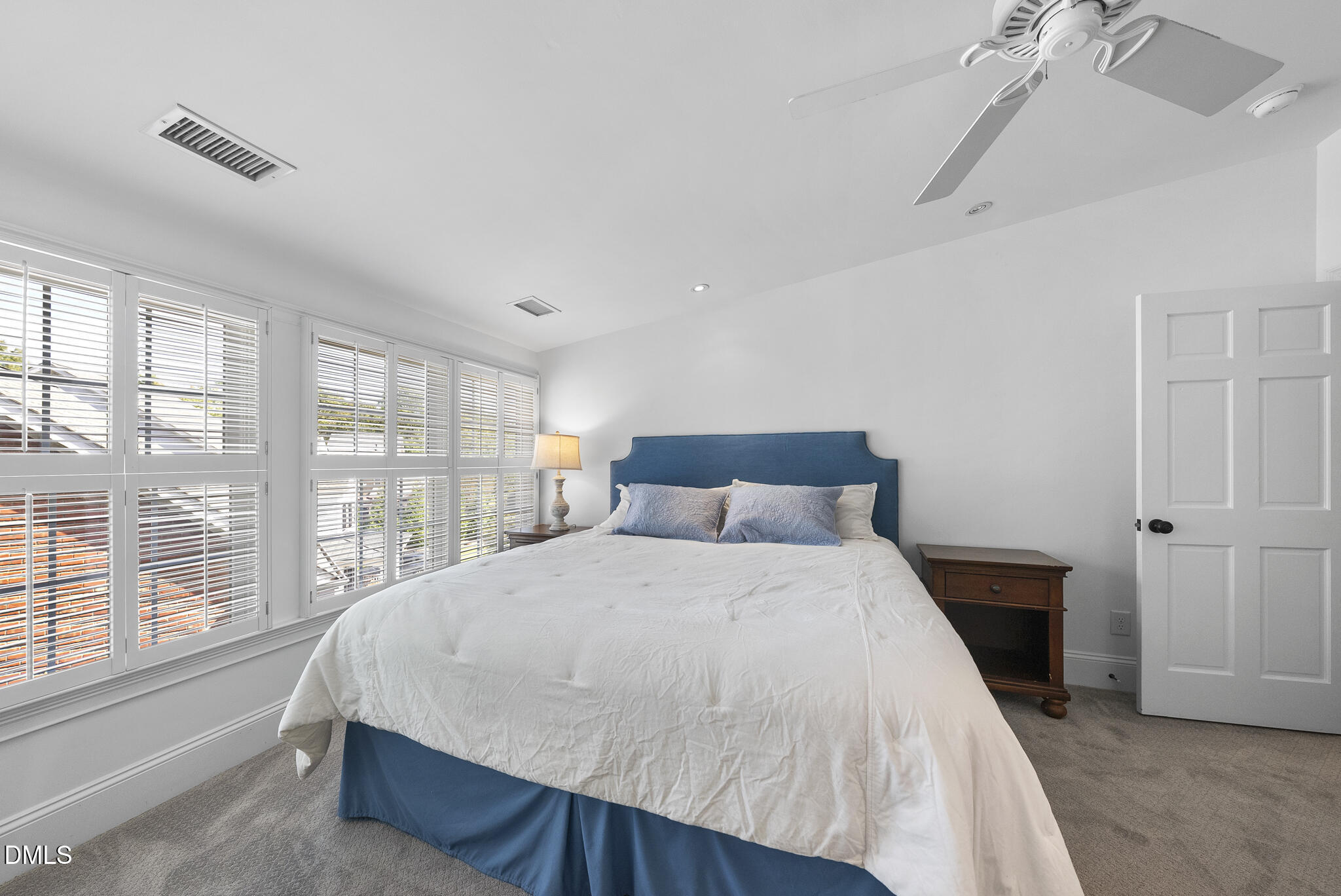 119 Faison Road Chapel Hill, NC 27517 - Photo 63 of 93 a large bed sitting in a bedroom next to a window