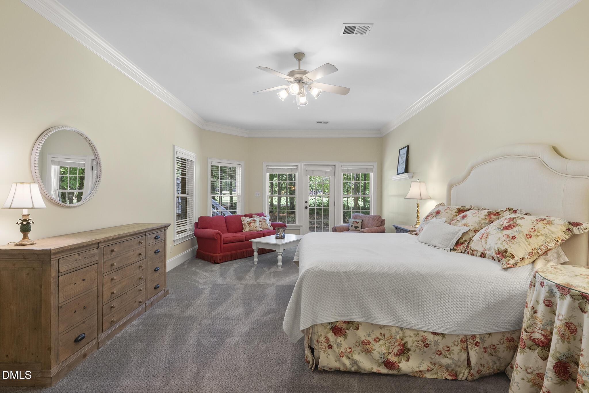 119 Faison Road Chapel Hill, NC 27517 - Photo 78 of 93 a bedroom with a bed and a chandelier