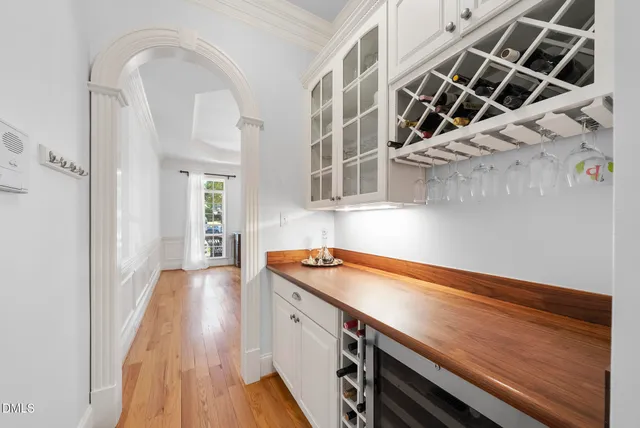 a living room with furniture and large windows