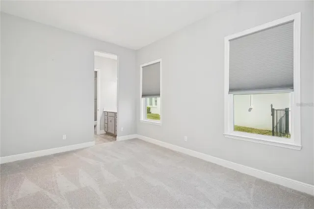 a utility room with cabinets washer and dryer
