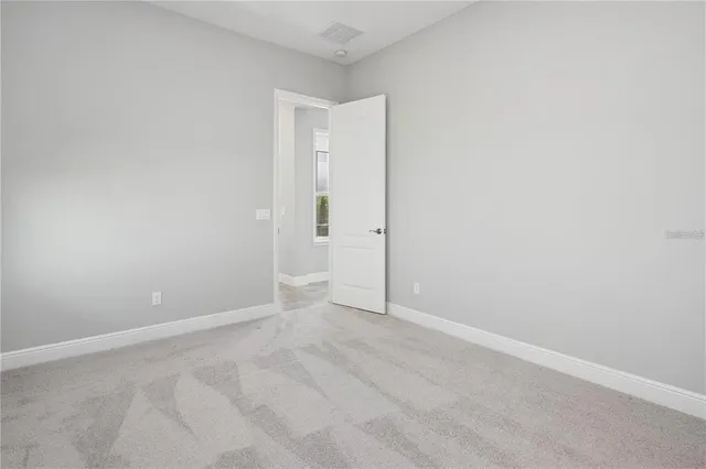 a utility room with cabinets washer and dryer