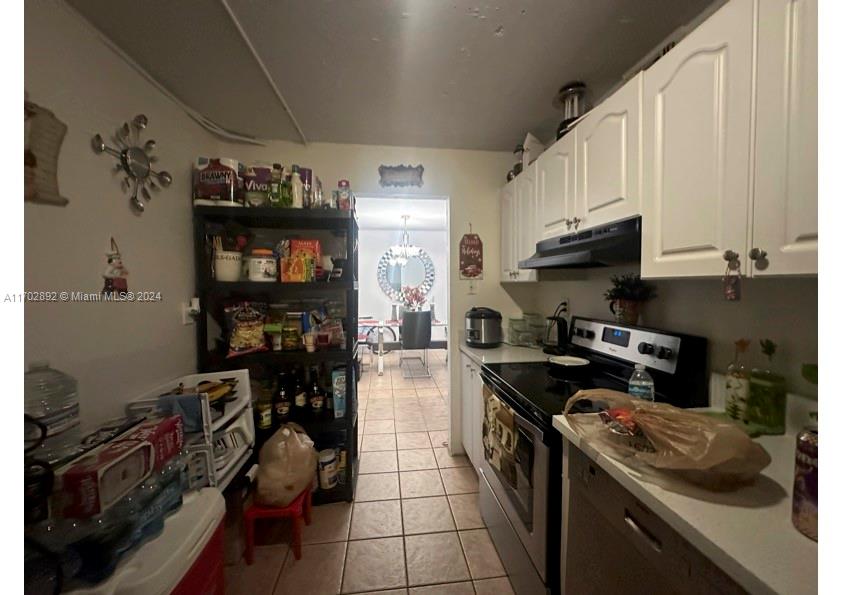 1800 Sans Souci Boulevard, Unit 239 North Miami, FL 33181 - Photo 9 of 15 a kitchen with a stove and a refrigerator